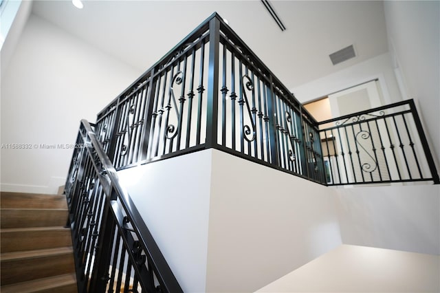 stairway with a towering ceiling