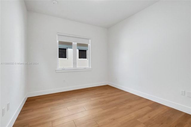 unfurnished room with light hardwood / wood-style floors