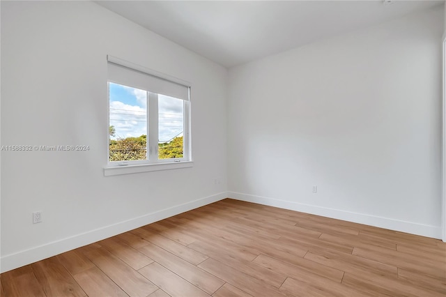 unfurnished room with light hardwood / wood-style flooring