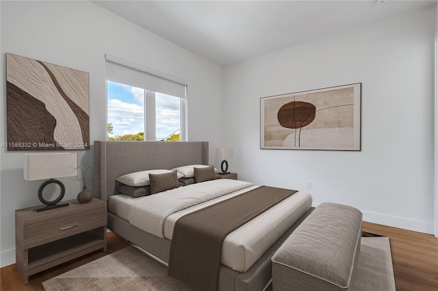 bedroom with wood-type flooring