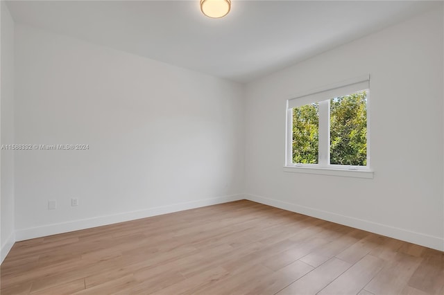 unfurnished room with light hardwood / wood-style flooring