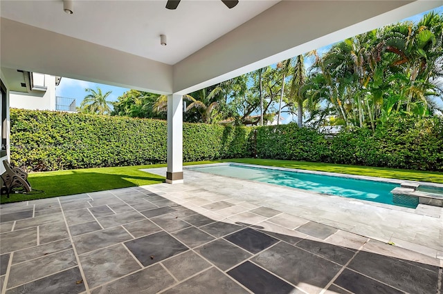 view of swimming pool featuring a patio area and a lawn