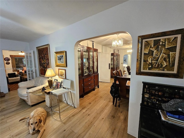 dining space featuring a notable chandelier and light hardwood / wood-style flooring