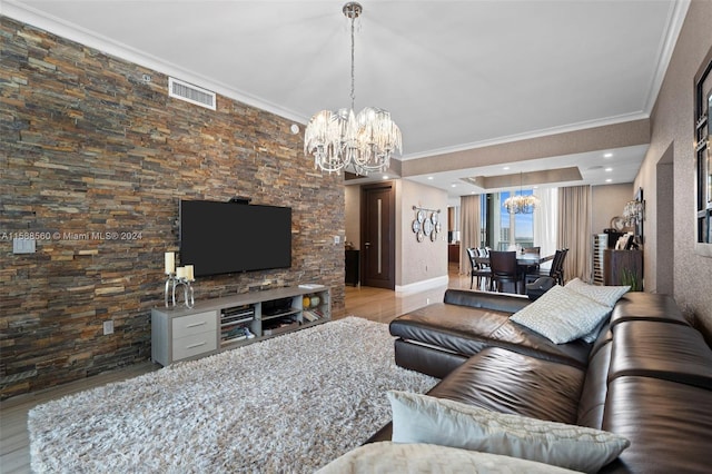 living room with a chandelier and crown molding