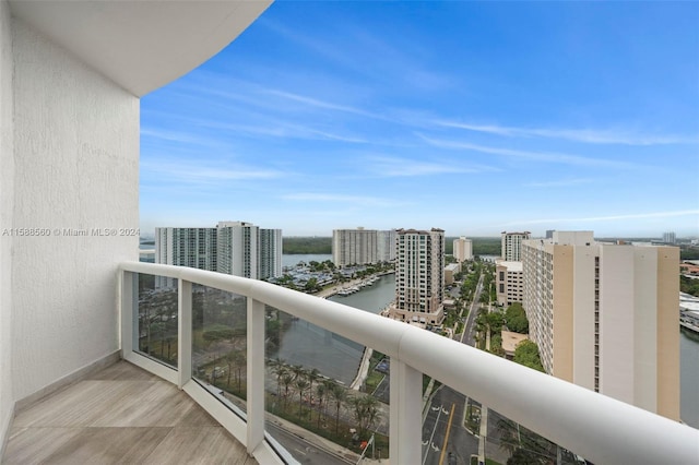 balcony featuring a water view