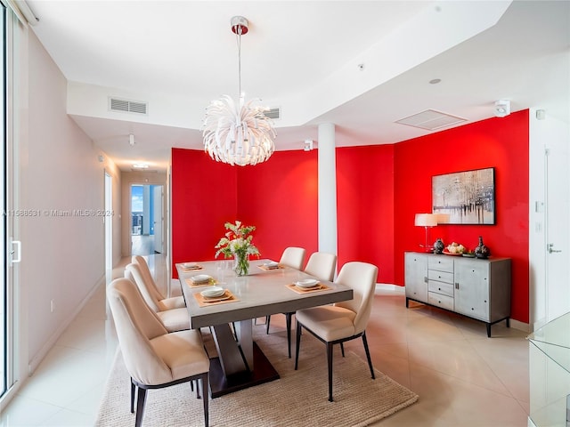 dining room featuring a chandelier and light tile patterned floors