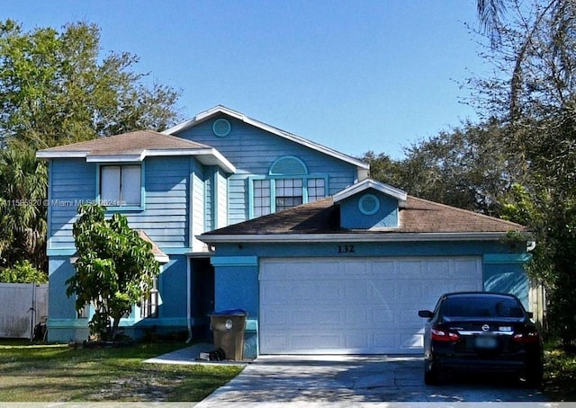 front of property with a garage