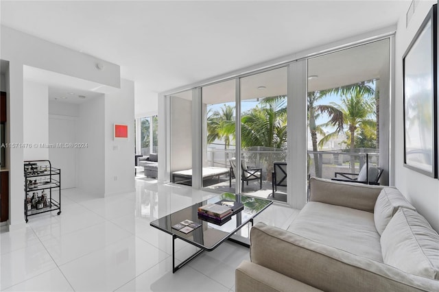 tiled living room featuring expansive windows