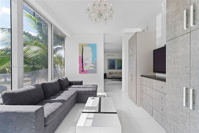 tiled living room with an inviting chandelier