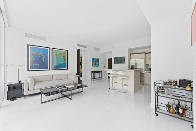 living room with light tile floors