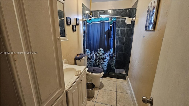 bathroom featuring walk in shower, vanity, toilet, and tile patterned floors