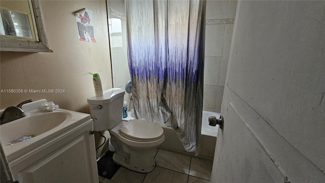 full bathroom featuring vanity, toilet, shower / bath combo with shower curtain, and tile patterned floors