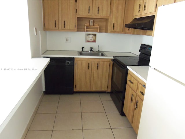 kitchen featuring wall chimney range hood, sink, black appliances, and light tile floors