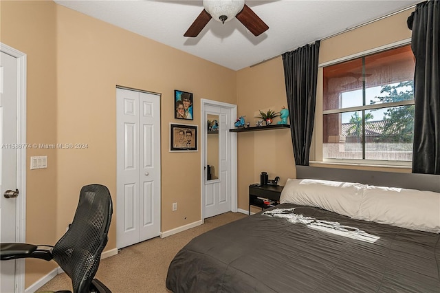 carpeted bedroom with ceiling fan