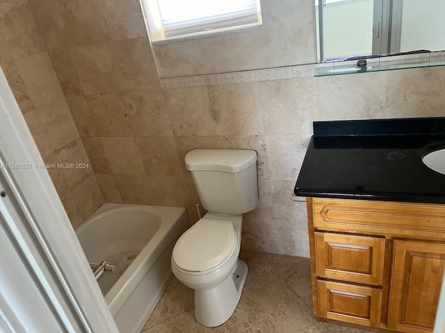 bathroom featuring tile walls, tile flooring, and vanity