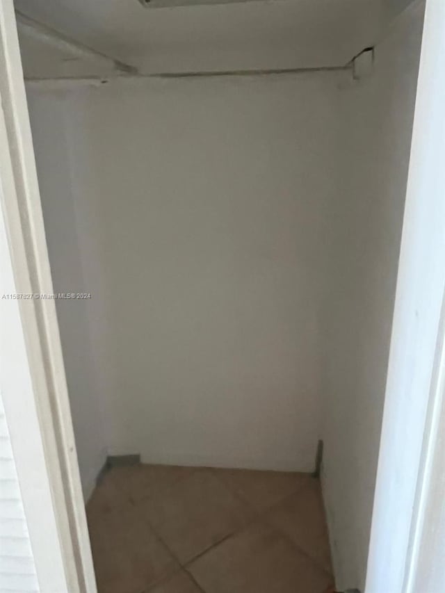 spacious closet featuring tile floors