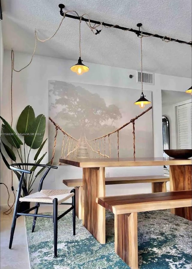 interior space featuring a textured ceiling