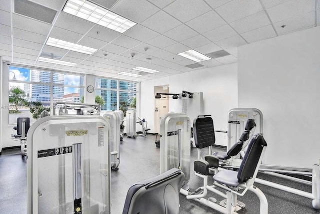 workout area with a paneled ceiling