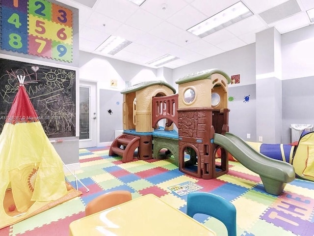 playroom featuring a drop ceiling