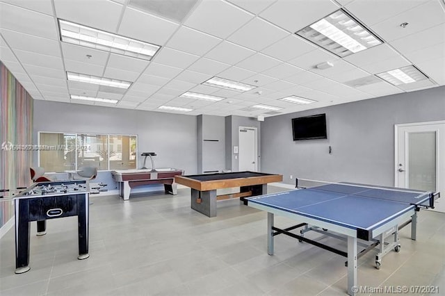 game room featuring pool table, tile floors, and a drop ceiling