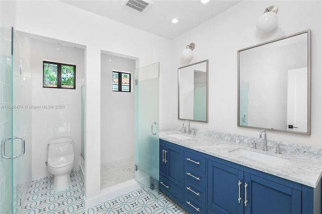 bathroom with tile flooring, an enclosed shower, double vanity, and toilet