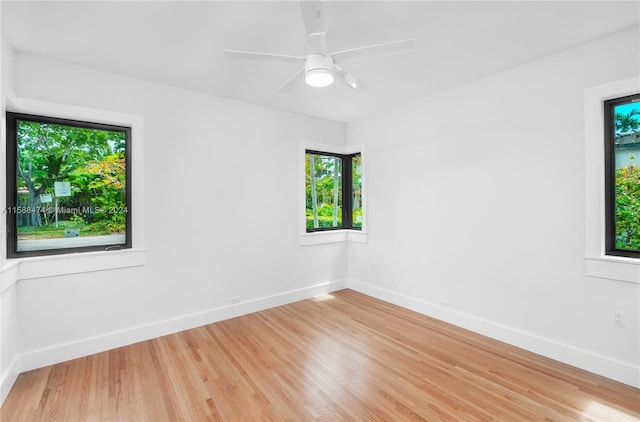 spare room featuring ceiling fan and light wood-type flooring