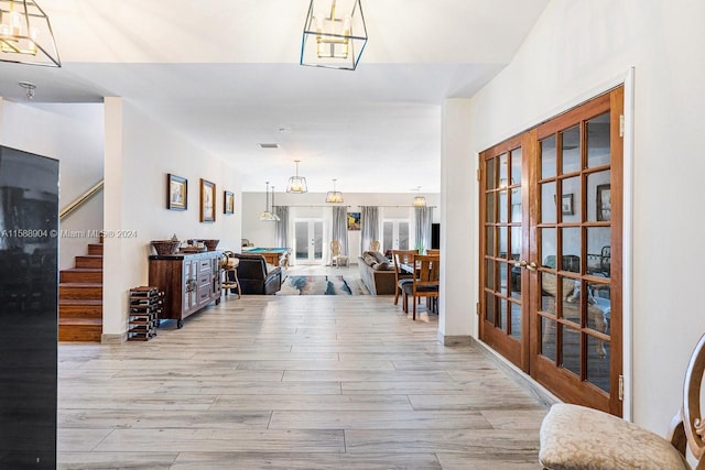 entryway featuring french doors and light hardwood / wood-style floors