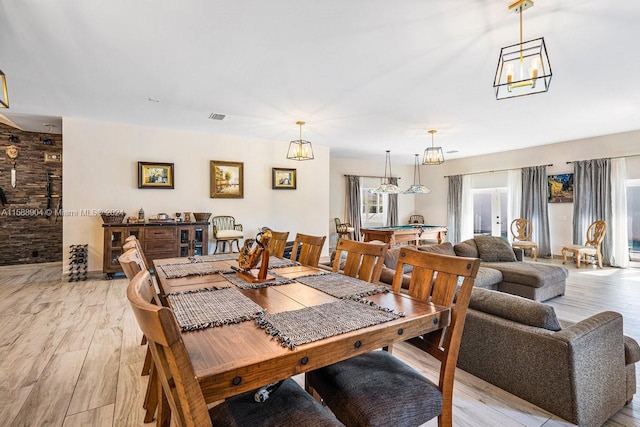 dining space featuring light wood-type flooring, billiards, and visible vents