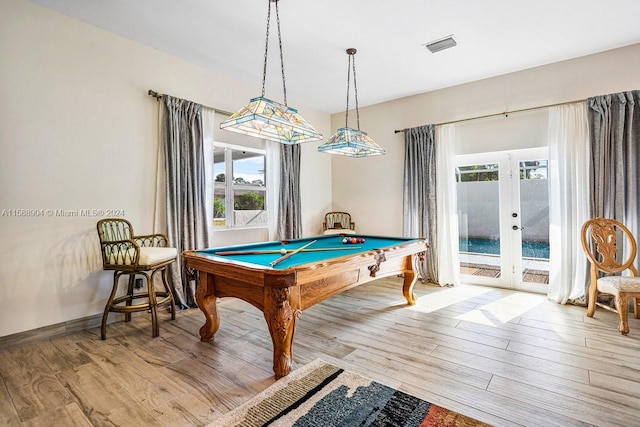 game room featuring french doors, pool table, visible vents, wood finished floors, and baseboards