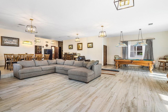 living room with pool table, visible vents, and wood finished floors