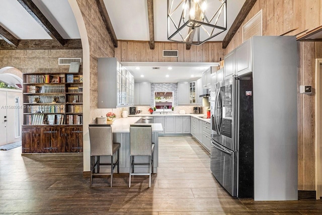 kitchen featuring light wood-style flooring, smart refrigerator, and visible vents