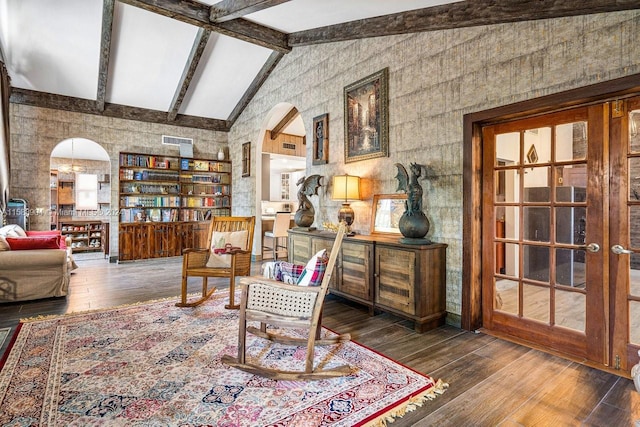 living area featuring beam ceiling, high vaulted ceiling, french doors, and dark hardwood / wood-style flooring