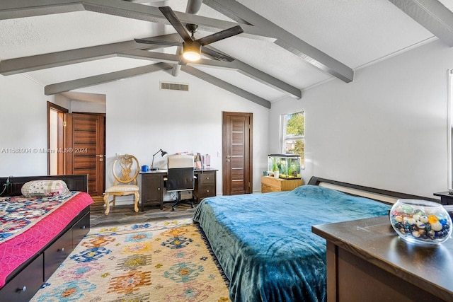 bedroom with ceiling fan, dark hardwood / wood-style floors, a textured ceiling, and vaulted ceiling with beams