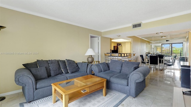 living room with crown molding and a textured ceiling