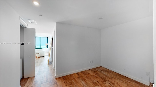 spare room featuring light hardwood / wood-style floors