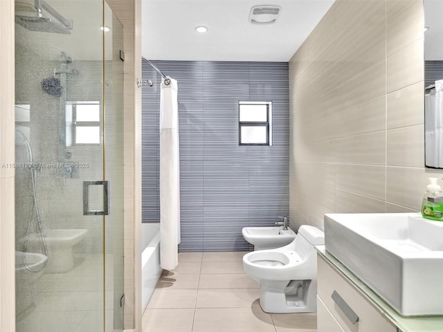 full bath with tile patterned flooring, a bidet, a tile shower, and tile walls