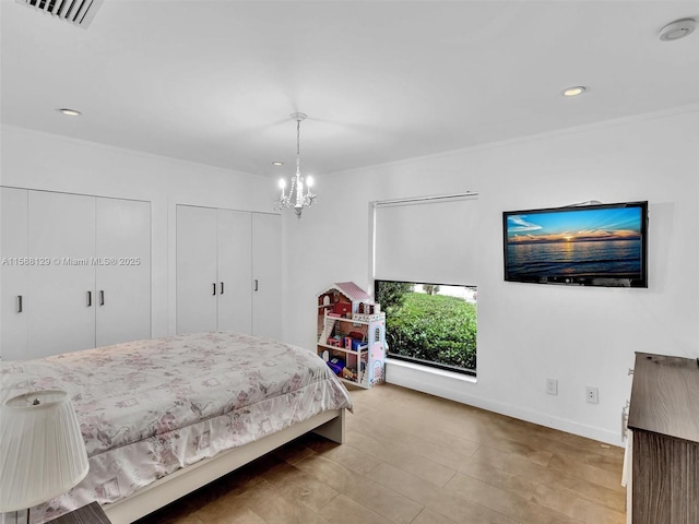 bedroom featuring a chandelier, recessed lighting, visible vents, baseboards, and multiple closets