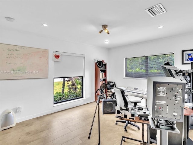 office featuring light wood-style flooring, visible vents, baseboards, and recessed lighting