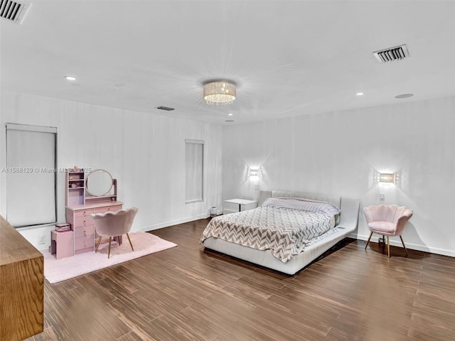 bedroom with dark wood-style flooring, visible vents, and baseboards