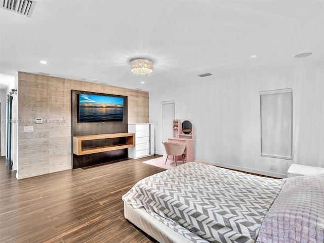 bedroom with visible vents, a chandelier, dark wood-style flooring, and recessed lighting