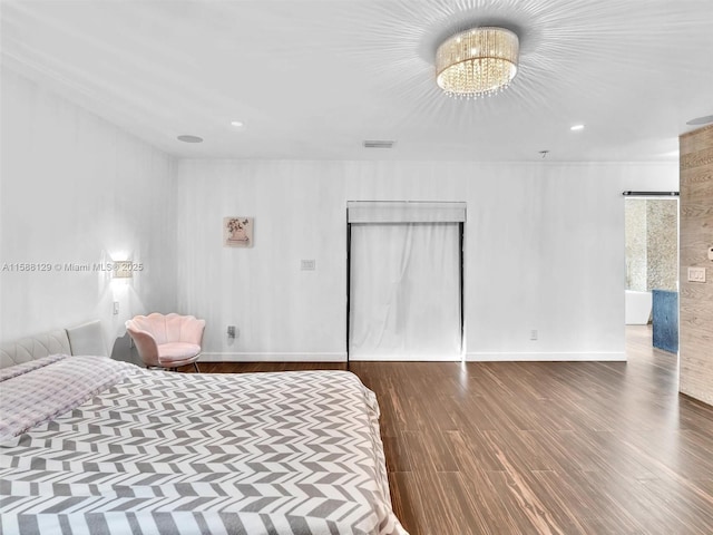 bedroom with a chandelier, recessed lighting, dark wood-type flooring, visible vents, and baseboards