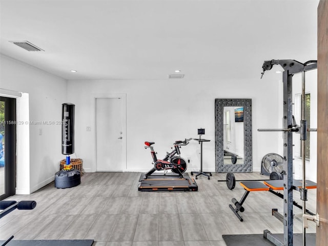 exercise area with recessed lighting, visible vents, and baseboards