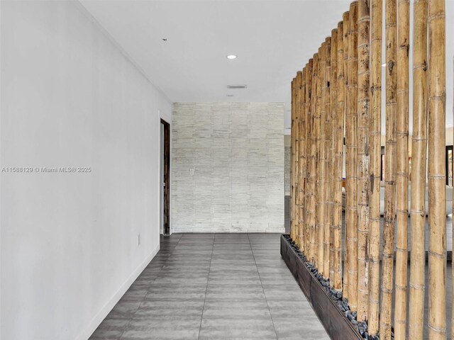 hallway featuring tile patterned floors