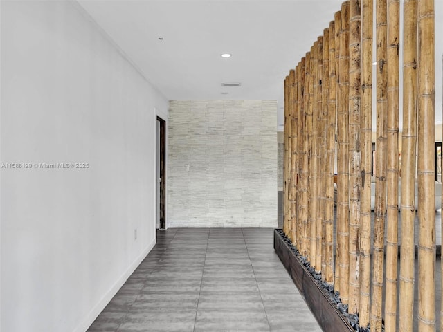 hall with tile patterned flooring, visible vents, and recessed lighting