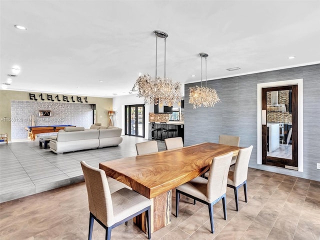 dining area featuring an inviting chandelier and recessed lighting