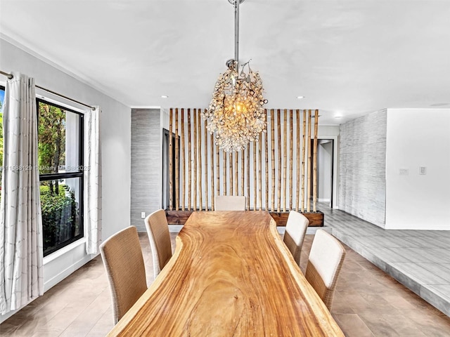 dining area with recessed lighting and an inviting chandelier