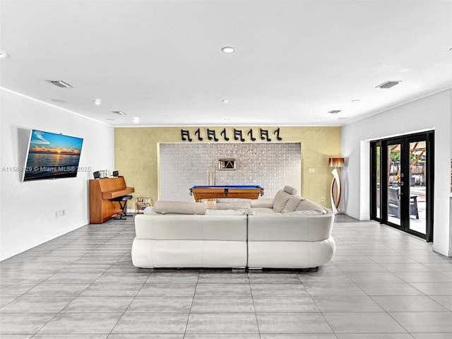 living room with recessed lighting, baseboards, visible vents, and french doors