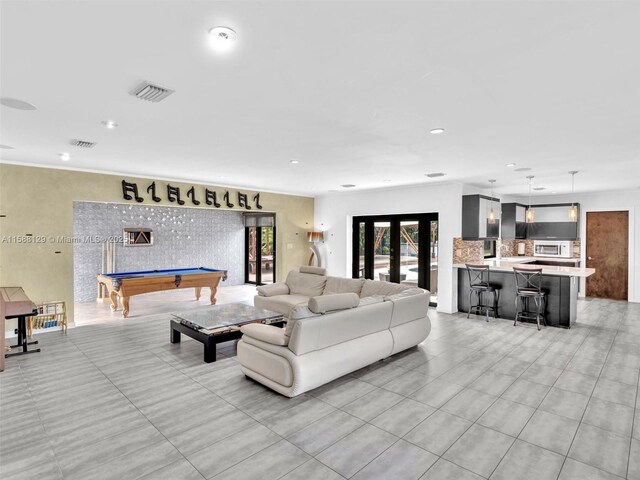 living room featuring french doors and billiards