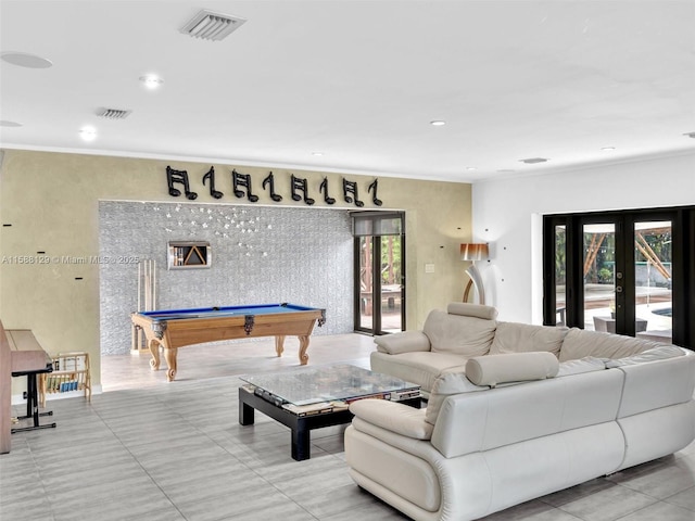 living room with french doors, pool table, and crown molding