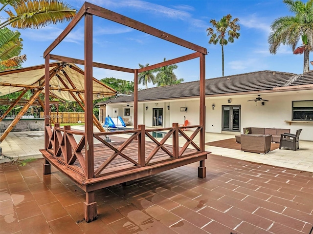 view of patio / terrace with french doors, ceiling fan, and outdoor lounge area